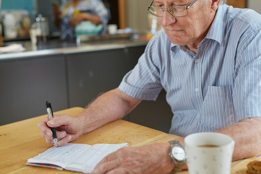older man reading financial report